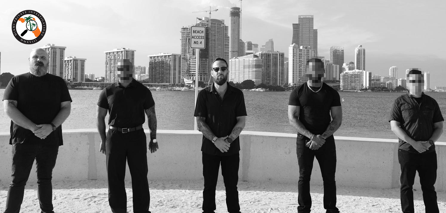 Miami Private Investigations team at Biscayne Bay with the Miami skyline behind them